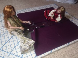 Measuring and cutting; Tori helps to keep the ruler from slipping around...